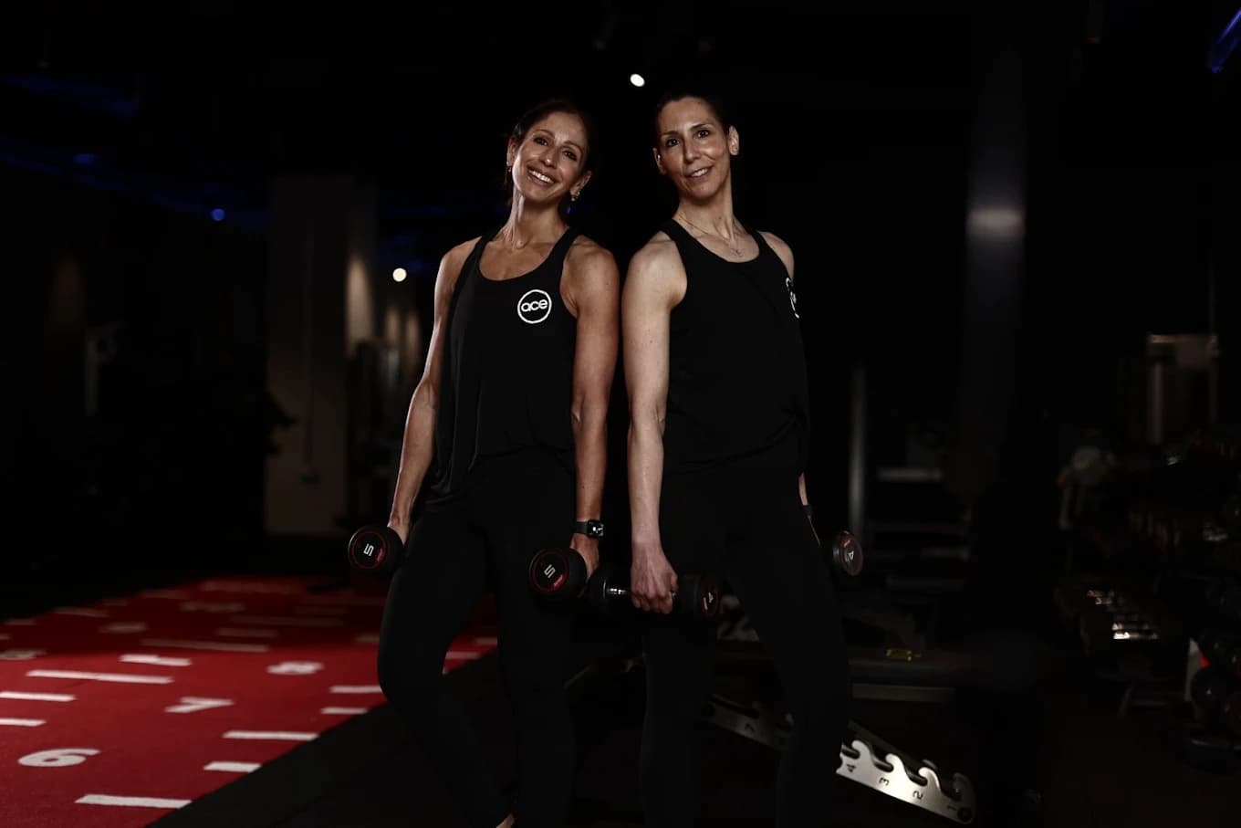 Anna and Charlotte in the ace lifestyle studio with dumbbells, coaching strength training for women 40+